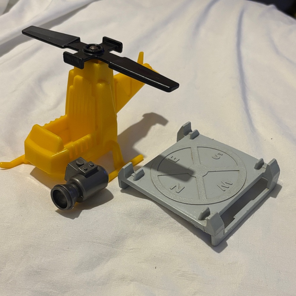 Vintage Fisher-Price helicopter with landing pad